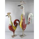 A pair of fabricated and painted metal chickens of comical form,