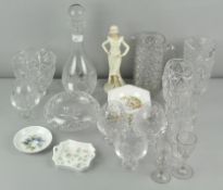 A collection of glassware to include a decanter and a Regal china figure.