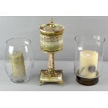 Two glass candle holders with candles an onyx lamp,