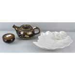 An Art pottery slip decorated tea pot and covered dish, together with a floral form dish,