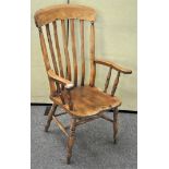 A late 19th century Elm farmhouse chair, having tall rail backrest, squared saddle seat,