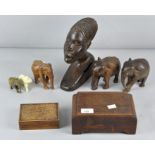 A collection of wood tribal figures, to include elephants,