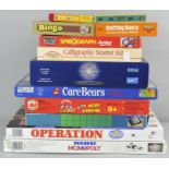 A collection of games, to include Junior Monopoly, Operation,