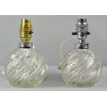 A pair of Pressed glass bulbous table lamps of globe form with spiral decoration,