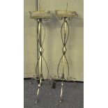 A pair of metal Pricket candlestick stands being painted gold. Measures; 116cm.