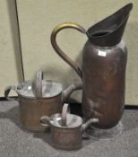 A large copper coal scuttle along with other copperware,