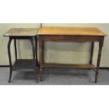 An Edwardian walnut side table, the rectangular top on turned legs with a shelf stretcher,