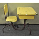 A mid 20th Century painted French children's school desk having a tubular metal construction,