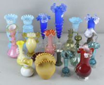 A large collection of late 19th/early 20th century ruffled glass vases and jugs,