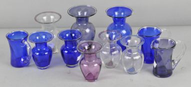 A mixed collection of assorted Sark Studio glass items, including vases and pouring vessels etc,