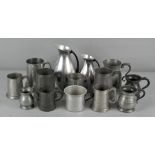 A collection of pewter jugs