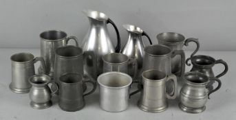 A collection of pewter jugs