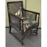 An early 20th century Bergere upholstered armchair,
