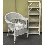 A white painted wicker chair along with a set of painted bamboo shelves,