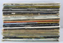 A collection of assorted vinyls, mostly rock, to include Fleetwood mac, Tangerine Dreams,
