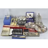 A quantity of silver plate, to include a cruet set, flatware and a teapot,