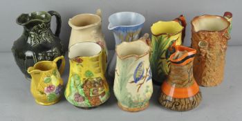 A collection of ceramic jugs to include; Arthur Wood, falcon ware and more,