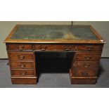 A reproduction twin pedestal desk with green leather top and three frieze drawers,