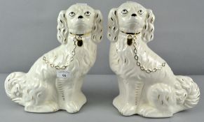 Two 20th century continental Staffordshire dogs, with gilt decoration,