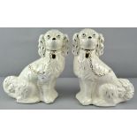 Two 20th century continental Staffordshire dogs, with gilt decoration,