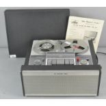 A vintage HMV His Masters Voice reel to reel tape recorder and a group of tapes