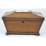 A Regency mahogany tea caddy, of sarcophagus form, with three lidded compartments,