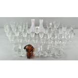 A collection of glassware, including a candlestick and drinking glasses,
