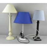 Two metal table lamps and a panted turned wood lamp.