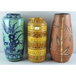 A collection of three assorted retro vintage West German pottery floor vases,
