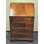 A 20th century Mahogany Bureau chest, fall front with fitted interior,