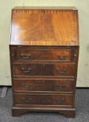 A 20th century Mahogany Bureau chest, fall front with fitted interior,