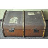 A large vintage wooden bound steamer trunk,