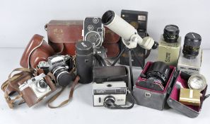 A quantity of camera equipment to include Cannon Zoom 35-70 lens, Ilford camera and more.