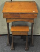 A 20th Century beech wood child's wooden desk and stool,