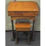 A 20th Century beech wood child's wooden desk and stool,