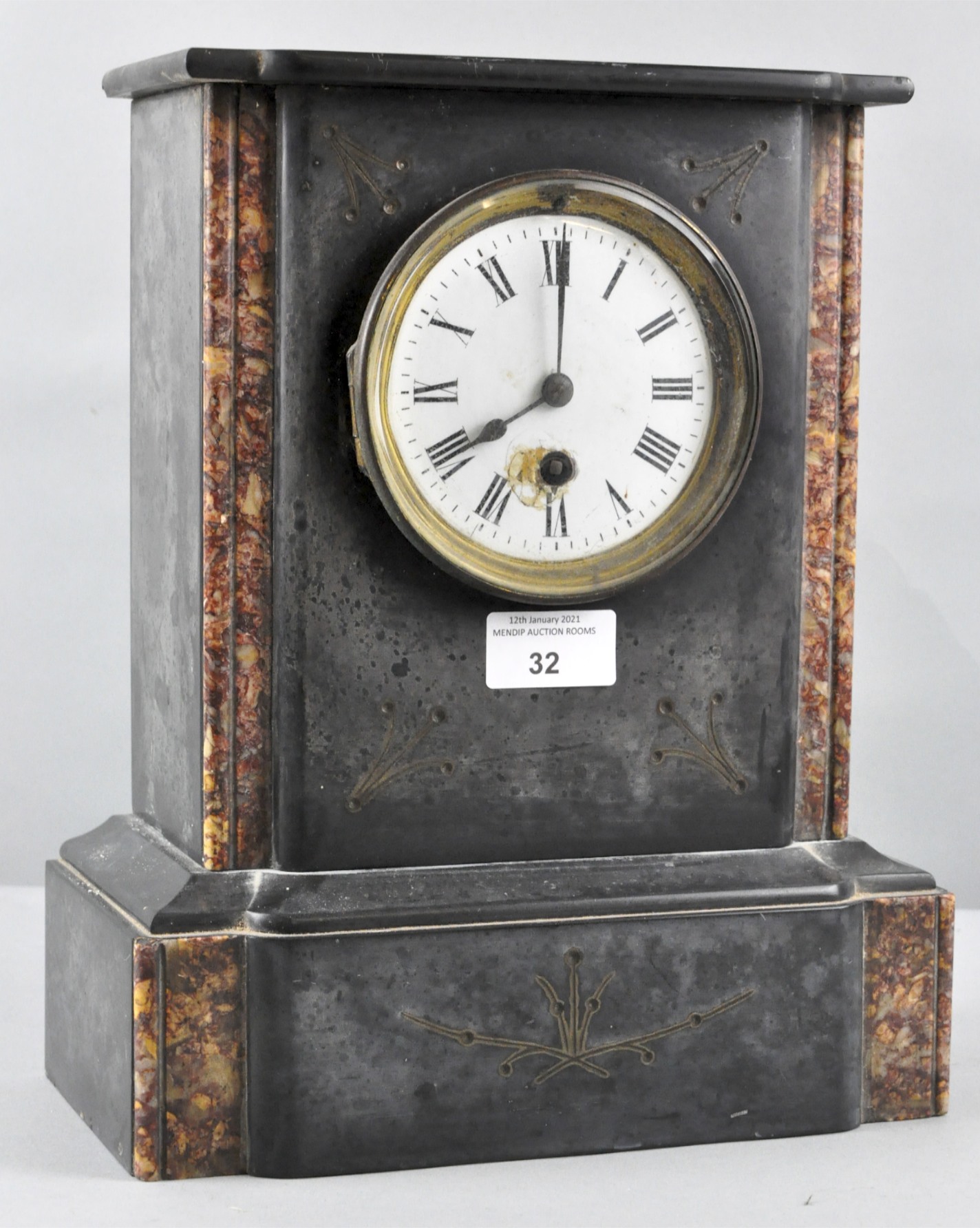 A 19th century black slate and specimen marble mantel clock with white enamel Roman dial,