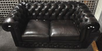 A vinyl two seater Chesterfield sofa,
