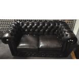 A vinyl two seater Chesterfield sofa,