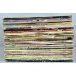 A collection of vinyl LP's including rock and jazz.