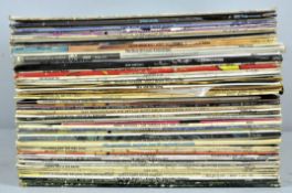 A collection of vinyl LP's including rock and jazz.