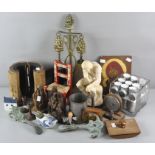 A collection of assorted items, including a brass fire companion set, religious wooden carvings,