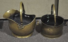 Two late 19th Century brass coal buckets with swing handles atop. Largest; 43cm high.