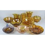 A collection of assorted 1930's pressed glass in an amber gold colourway.