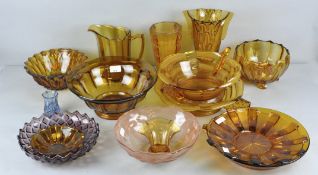 A collection of assorted 1930's pressed glass in an amber gold colourway.