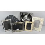 A collection of assorted photograph frames together with two decorative plaques,