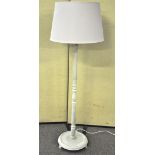 A painted wood standard lamp with fluted decoration and shade,