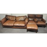 A John Lewis three piece suite comprising a leather sofa,