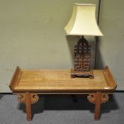 A 20th century Chinese style coffee table, 109cm long,
