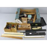 A selection of drawing equipment items to include rulers,
