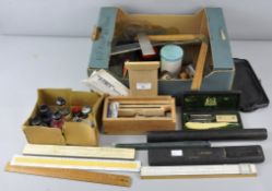 A selection of drawing equipment items to include rulers,